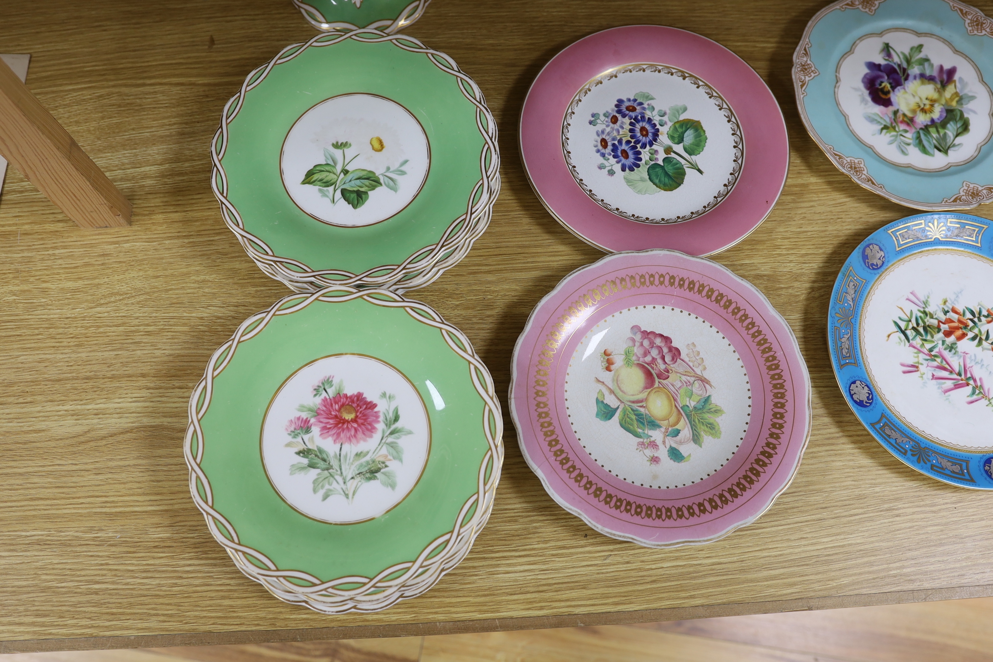 An English floral decorated comport and nine dessert plates, together with ten mixed floral patterned plates, largest 28cm in diameter